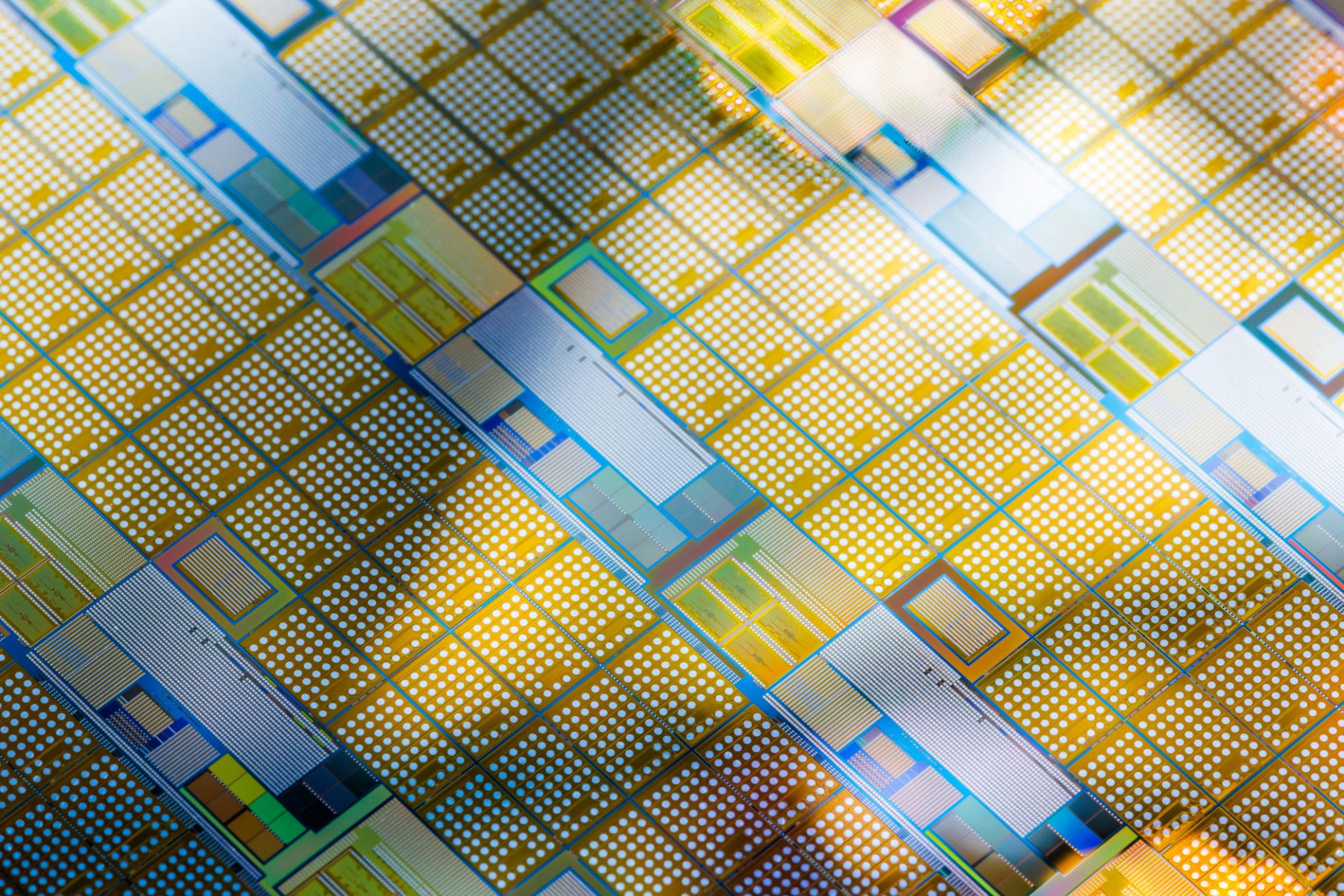 Close-up of a patterned semiconductor wafer used in advanced silicon carbide materials research.