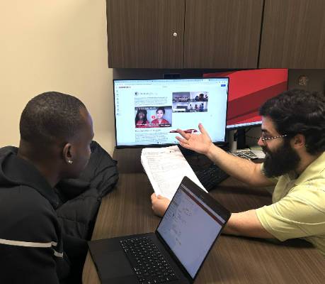 student working with advisor