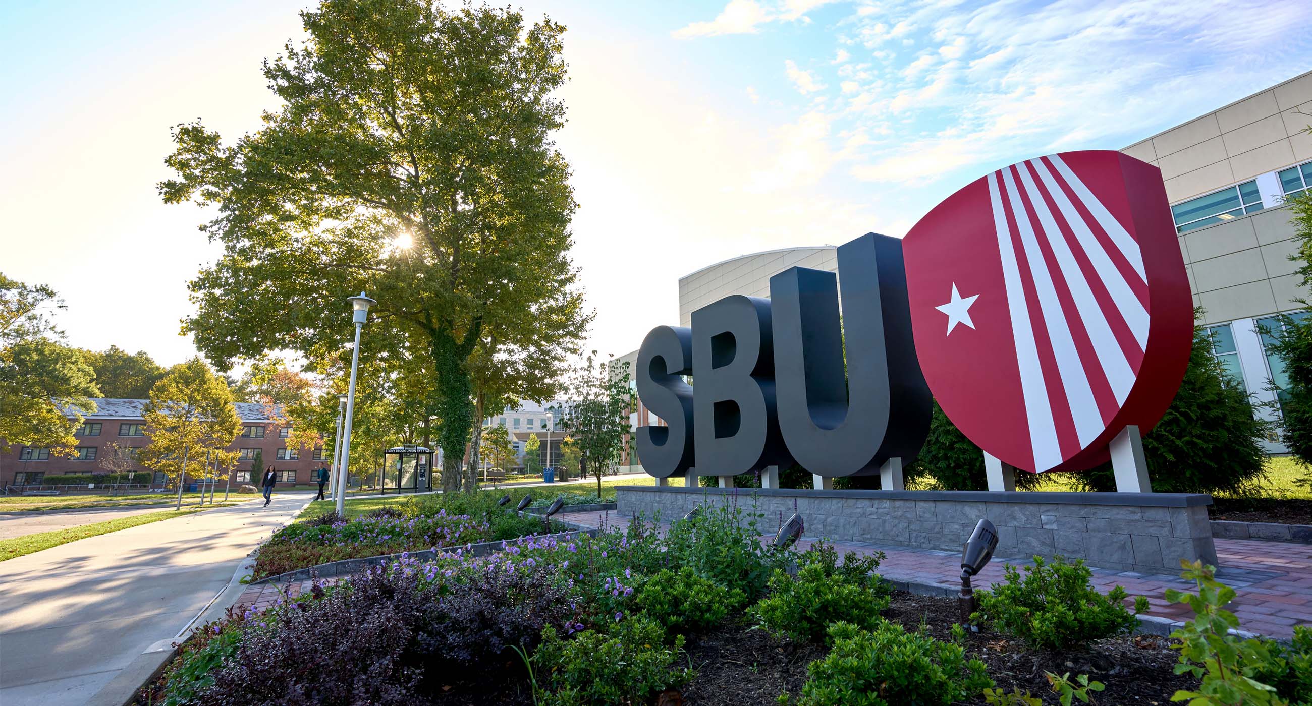 Landmark on campus with SBU and the shield logo.