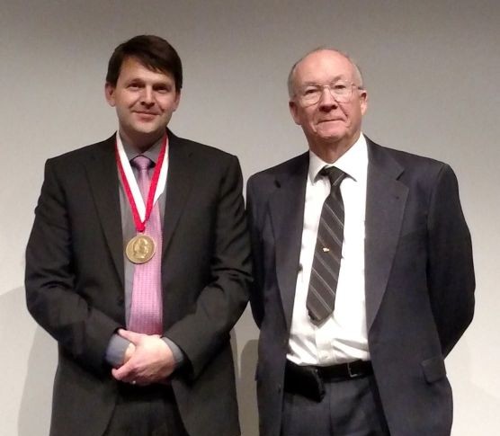 F. James Rohlf stands with Benedikt Hallgrímsson who is wearing his medal