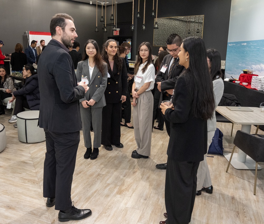 students talking with staff