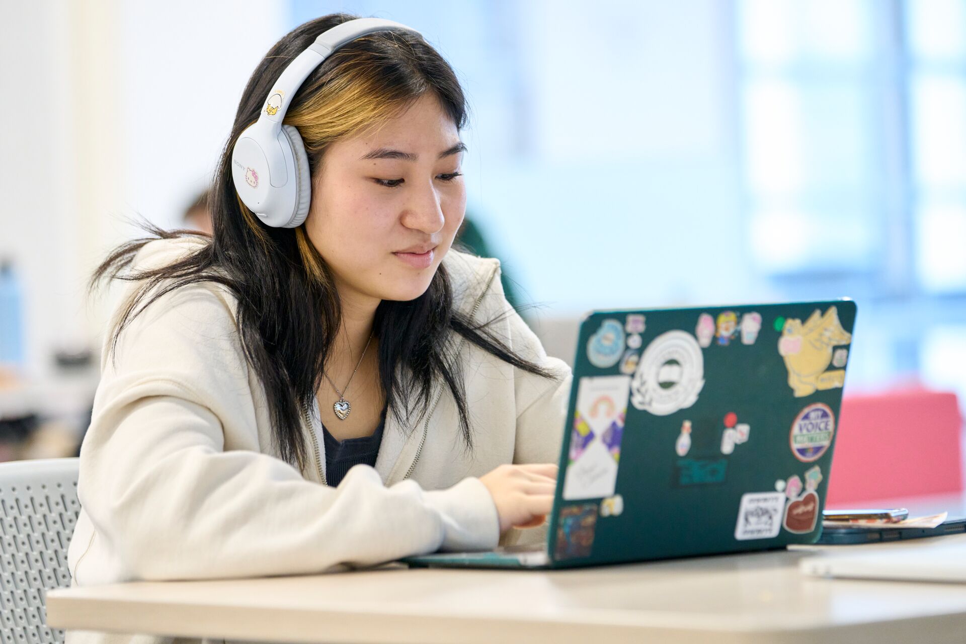 Student working on laptop.