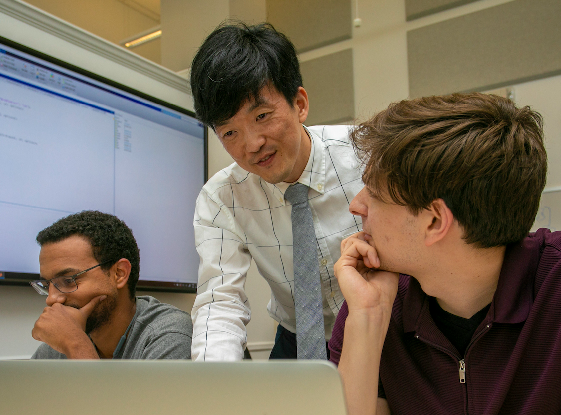 Professor talking to a student.