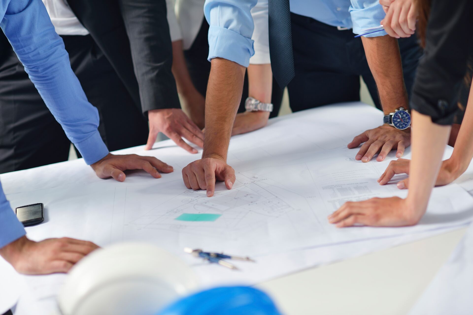 Hands on a sheet of paper working
