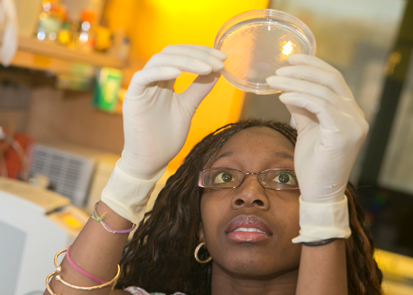 Student holding petri dish