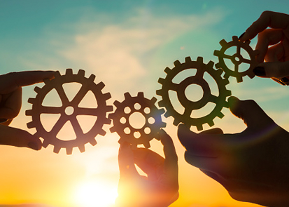 Hands holding gears