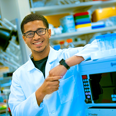 student in lab coat