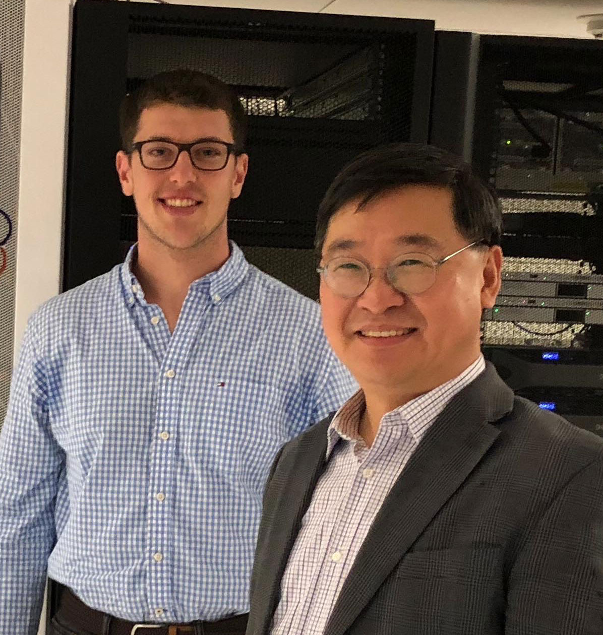 AMS grad student and facullty beside Seawulf supercomputer