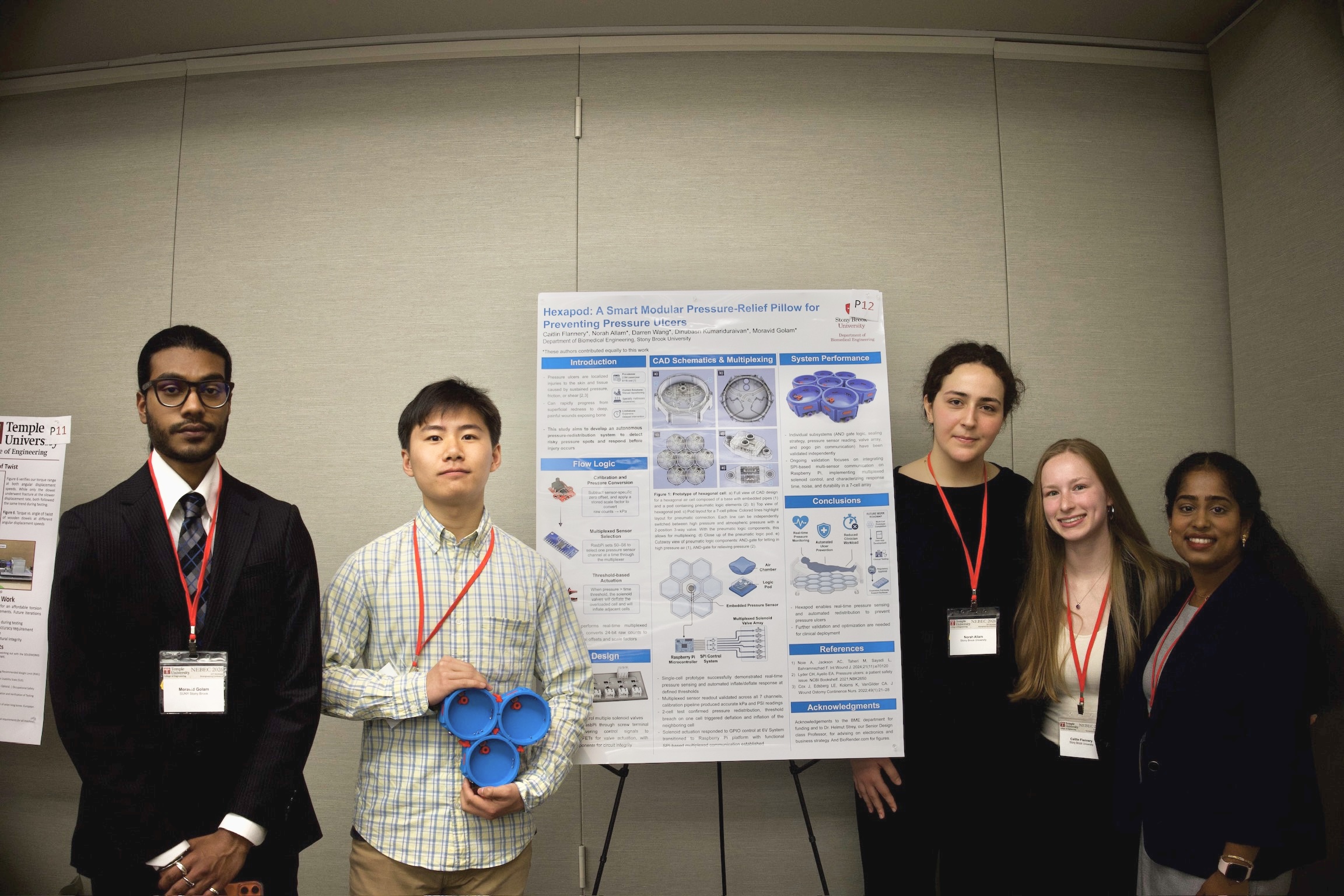 UG senior design group Senior design group posing next to their NEBEC 2026 poster