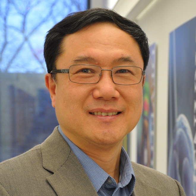 Dr. Qin Dr. Qin smiling