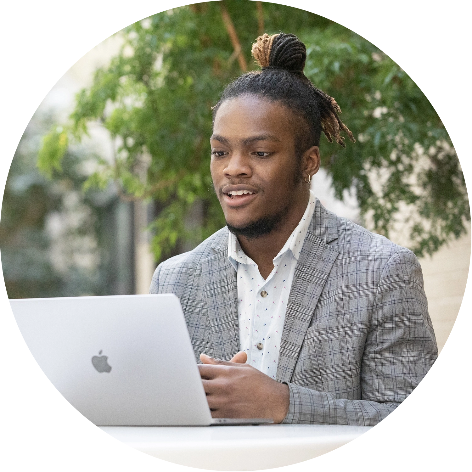 Online MBA student engaged in virtual class on laptop