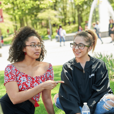 Two students talking on campus