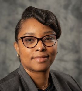 Bonita London Women in proffesional wear and glasses smiling