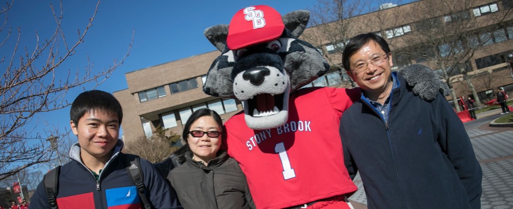 Wolfie with student and parents