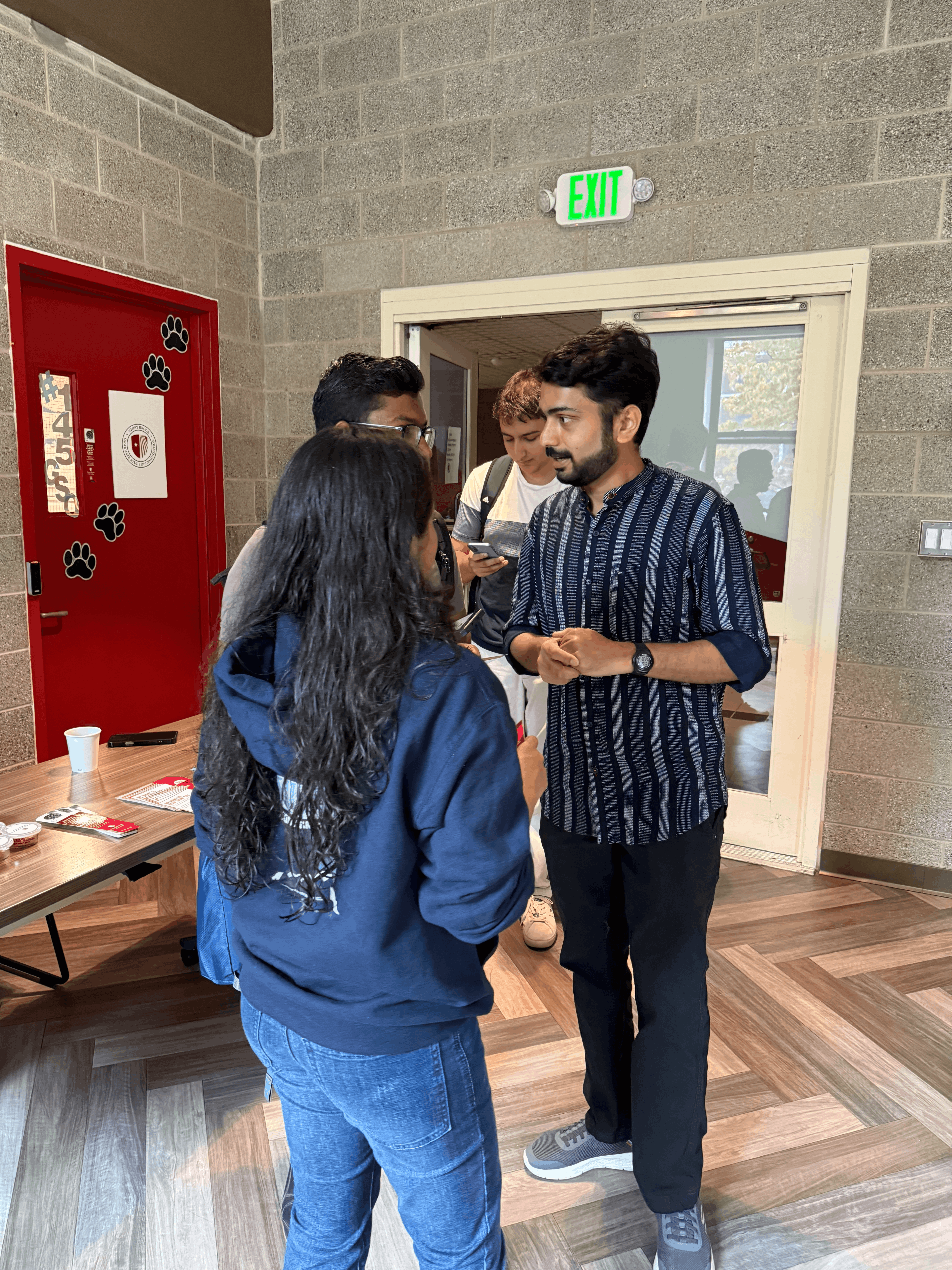 Graduate students conversing.