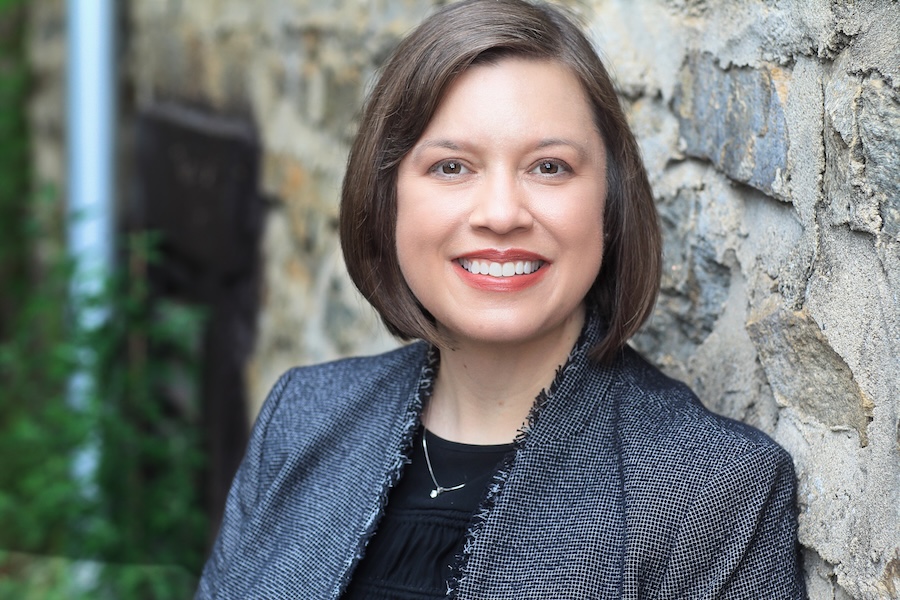 Stephanie Foote in front of a granite wall on a sunny day