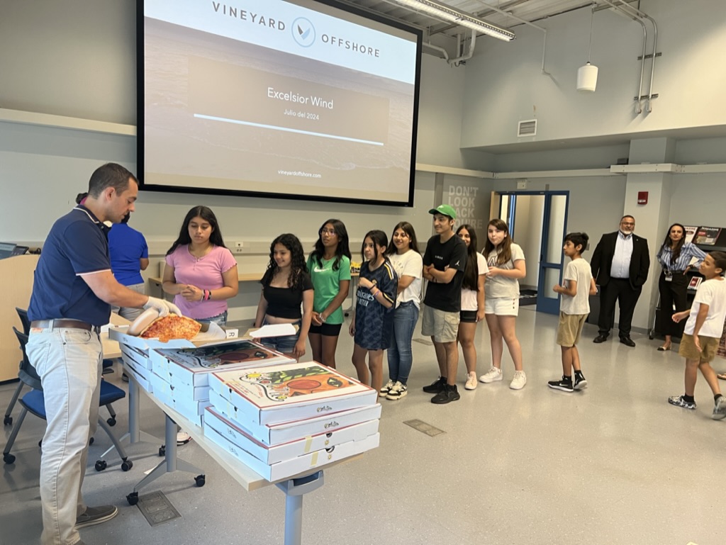 students waiting in line for pizza