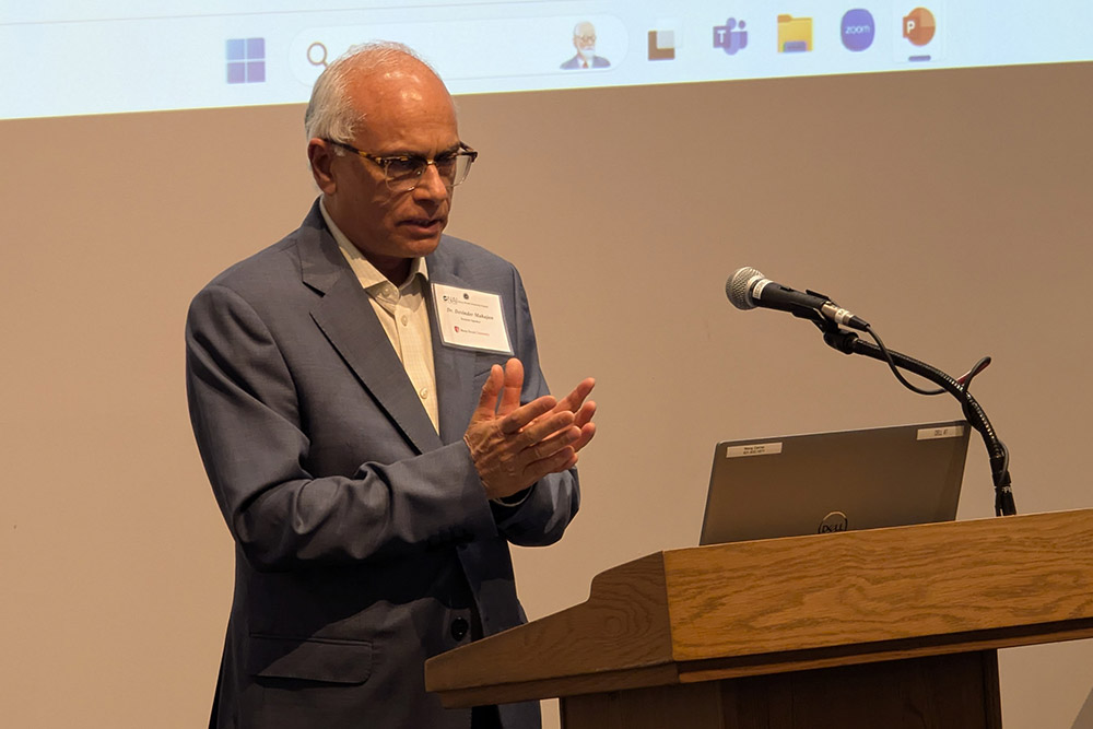 Devinder Mahajan, PhD at podium