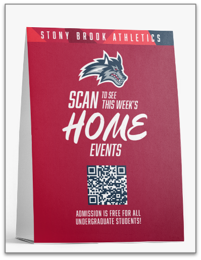 A printed tabletop sign for Stony Brook Athletics stands upright against a plain white background, prompting viewers to scan a QR code for event information.