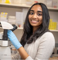 Hannah Philipose at microscope