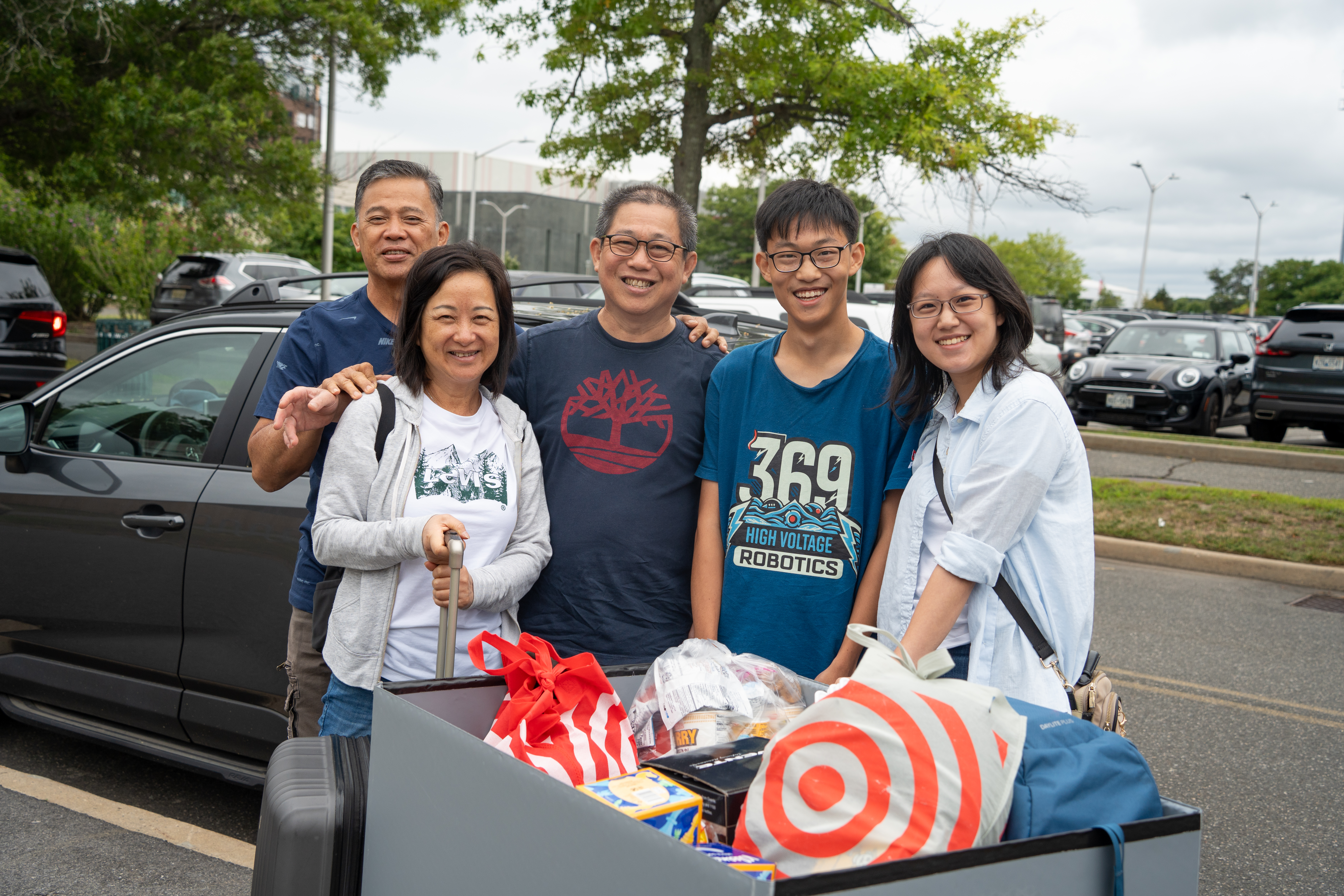 Family posing during fall move in