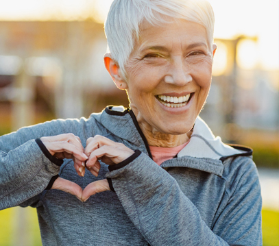 woman making a heart with her fingers