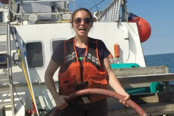 Emily Markowitz hoses down the deck of the Research Vessel Seawolf Emily Markowitz hoses down the deck of the Research Vessel Seawolf