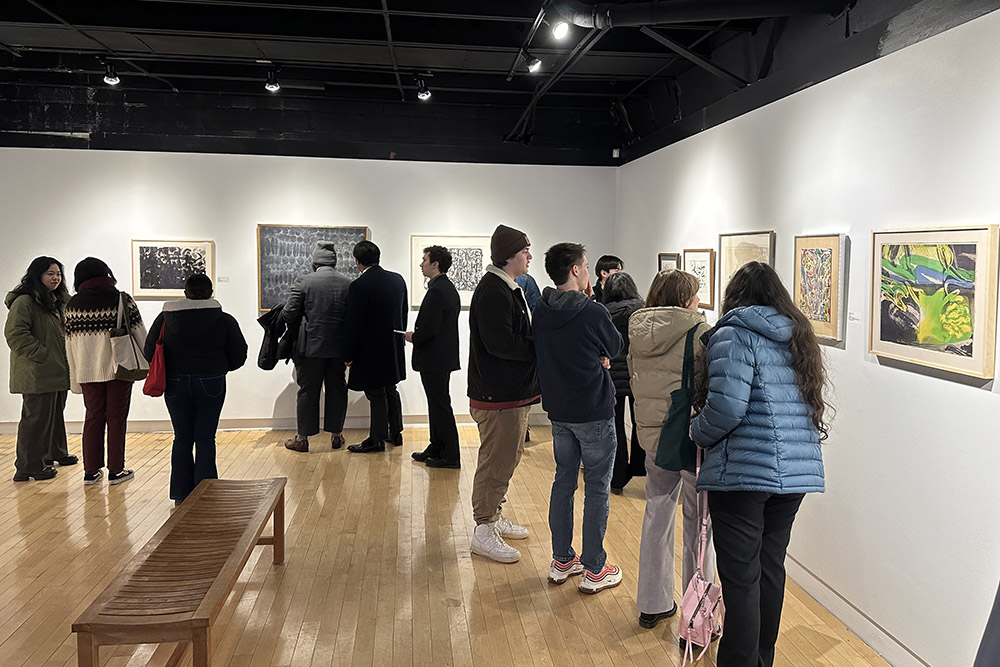 SBU students, faculty, and community members exploring the Avram Gallery