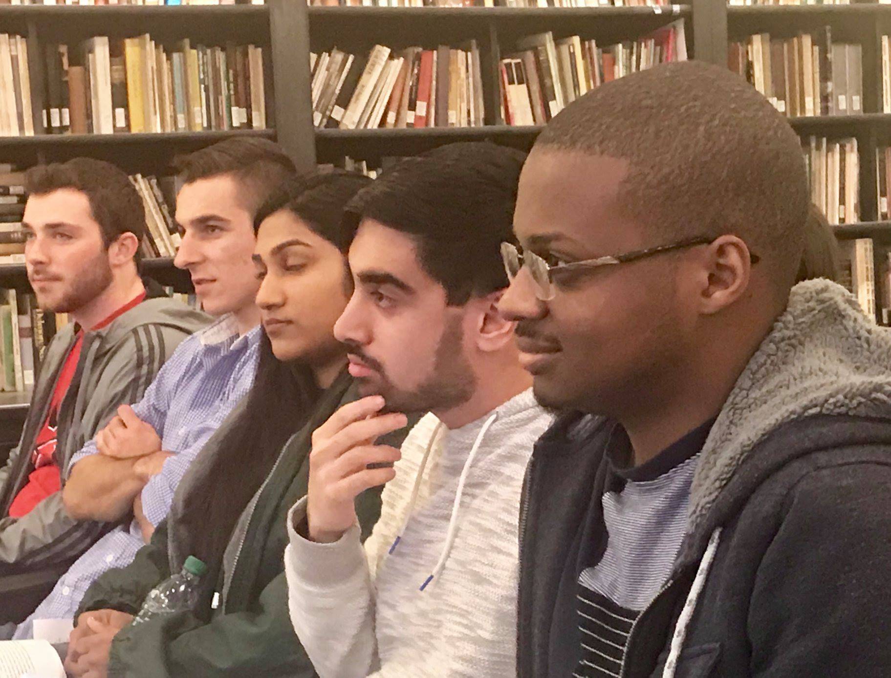 Students listening to a reading in the Poetry Center